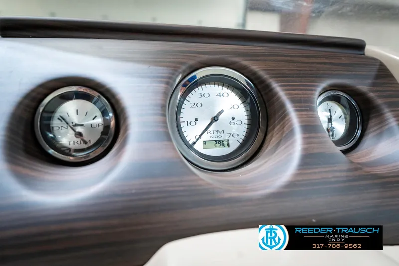 Slide: The Image of Dashboard gauges of a 2018 Bennington 20 SLMX boat, featuring RPM indicators. - 37