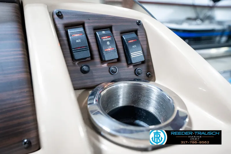 Slide: The Image of Control panel of 2018 Bennington 20 SLMX boat with cup holder and switches. - 39