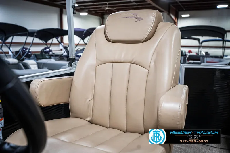 Slide: The Image of Luxurious beige captain's chair in a 2018 Bennington 20 SLMX boat. - 41