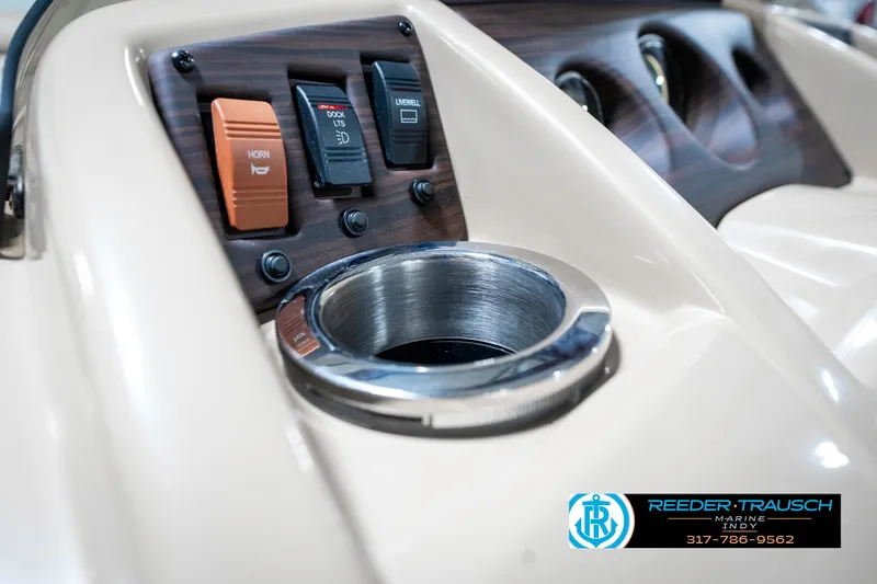 Slide: The Image of Control panel of a 2018 Bennington 20 SLMX boat with cup holder and switches. - 45