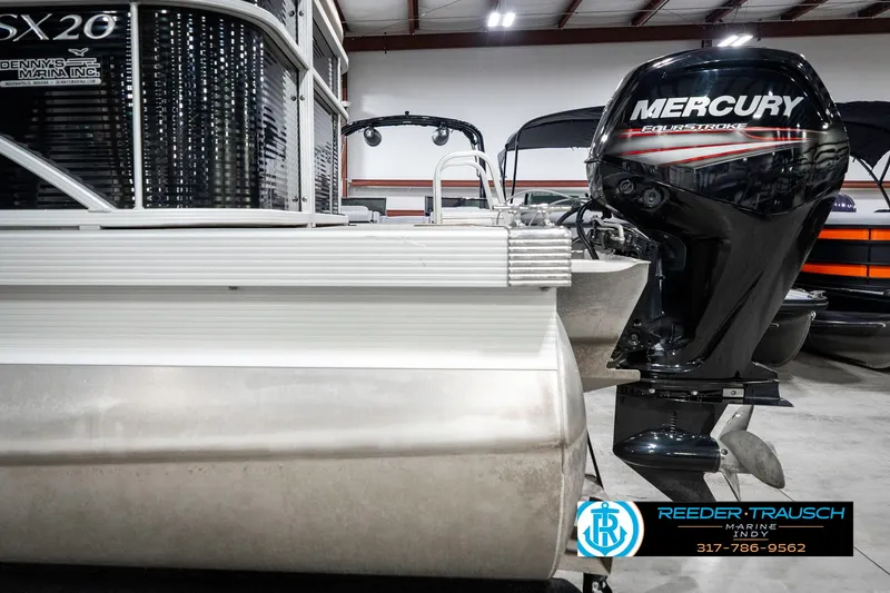 Slide: The Image of 2018 Bennington 20 SLMX pontoon boat with Mercury outboard motor in showroom. - 46