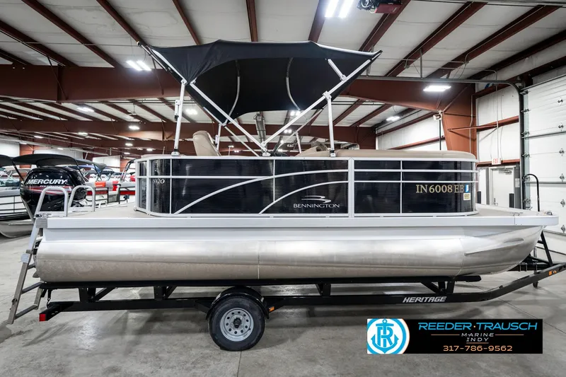 Slide: The Image of 2018 Bennington 20 SLMX pontoon boat on trailer in indoor showroom. - 7