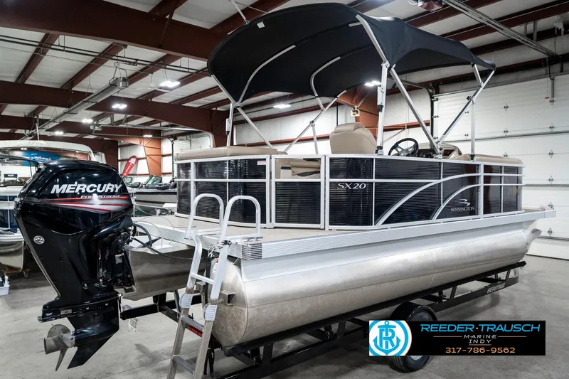 Slide: The Image of 2018 Bennington 20 SLMX pontoon boat with Mercury outboard motor in showroom. - 8