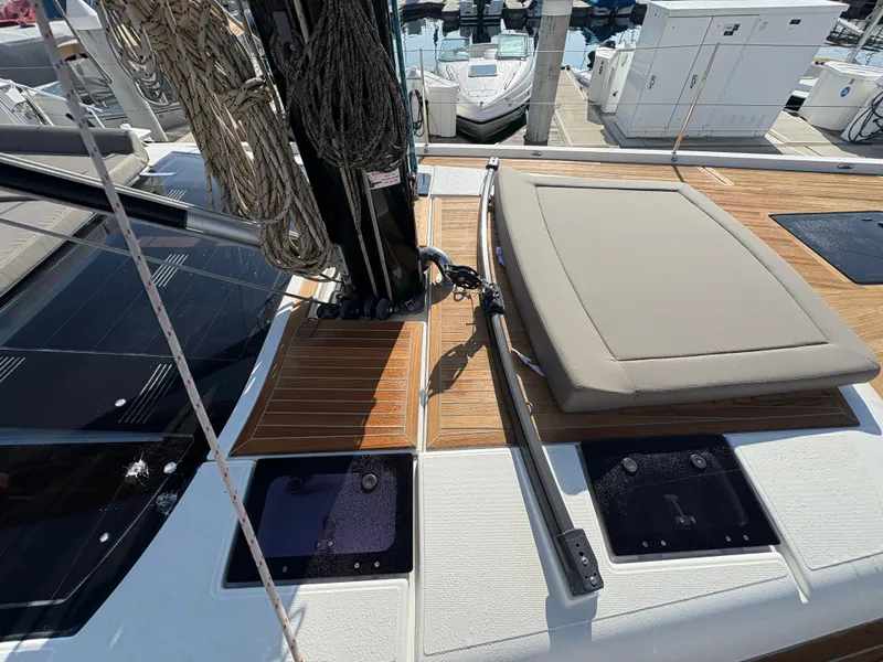 Slide: The Image of Dufour 560 Exclusive 2018 yacht deck with seating and rigging at a marina. - 14