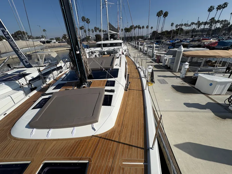 Slide: The Image of 2018 Dufour 560 Exclusive yacht docked at marina, showcasing sleek deck design and modern features. - 20