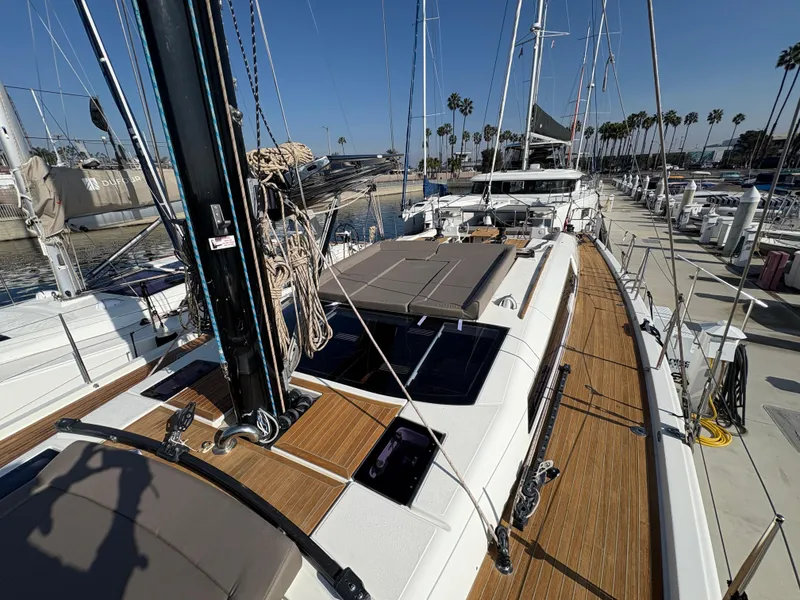 Slide: The Image of 2018 Dufour 560 Exclusive yacht docked, featuring sleek design and spacious deck. - 21