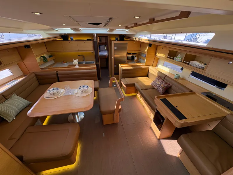 Slide: The Image of Luxurious interior of 2018 Dufour 560 Exclusive yacht with elegant seating and dining area. - 34