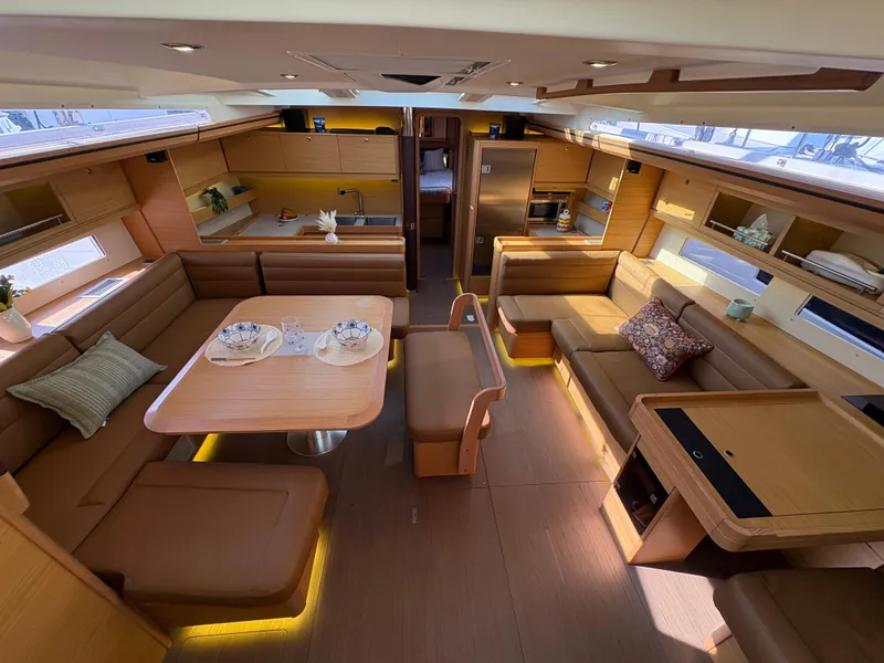 Slide: The Image of Luxurious interior of 2018 Dufour 560 Exclusive yacht with elegant seating and dining area. - 35