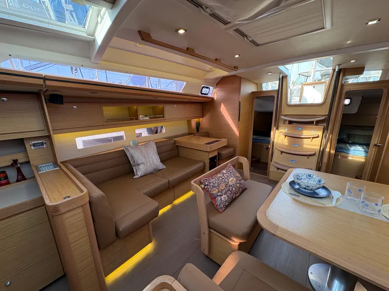Slide: The Image of Luxurious interior of 2018 Dufour 560 Exclusive yacht with elegant wood finish and cozy seating. - 41