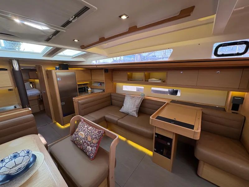 Slide: The Image of Luxurious interior of 2018 Dufour 560 Exclusive yacht with modern furnishings and ample seating. - 42
