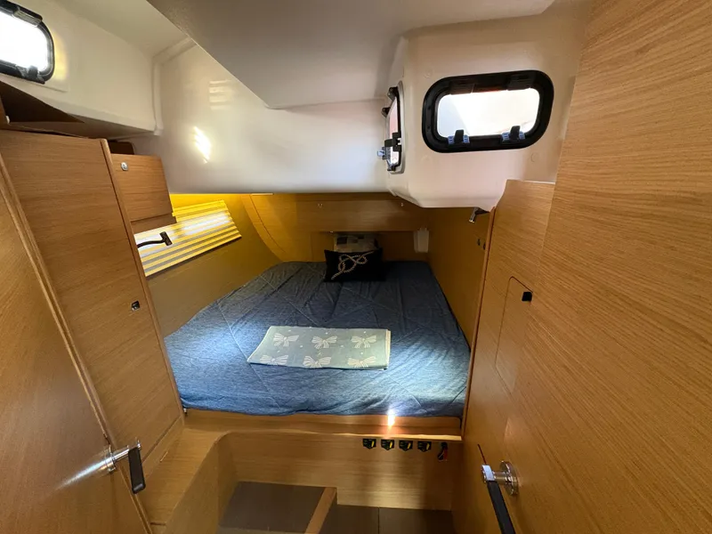 Slide: The Image of Cabin interior of 2018 Dufour 560 Exclusive yacht with cozy bed and wooden finish. - 43