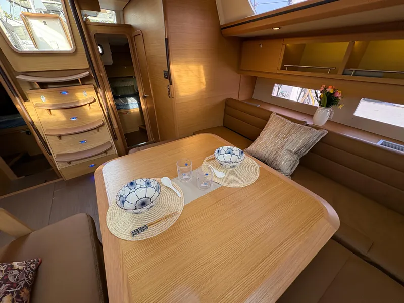 Slide: The Image of Luxurious interior of 2018 Dufour 560 Exclusive yacht with elegant dining setup. - 46