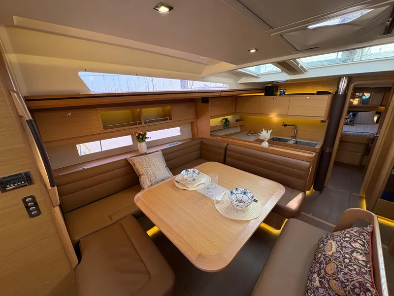 Slide: The Image of Luxurious interior of 2018 Dufour 560 Exclusive yacht with elegant dining area and modern kitchen. - 47