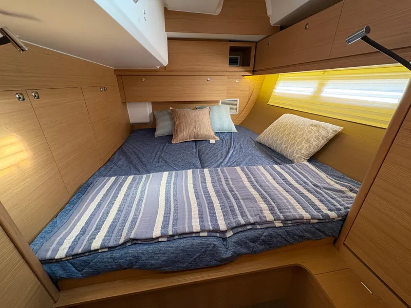 Slide: The Image of Cozy cabin interior of 2018 Dufour 560 Exclusive yacht with comfortable bedding. - 50