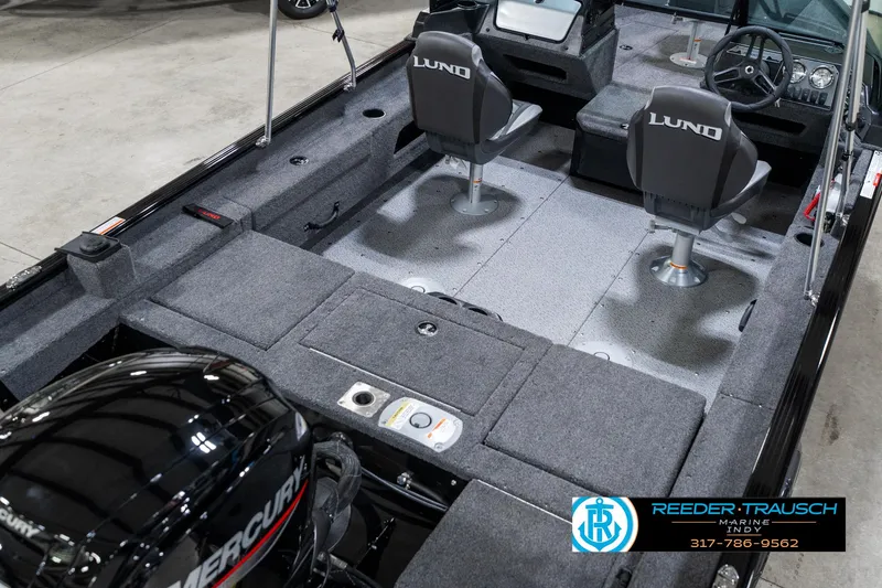 Slide: The Image of 2025 Lund 1775 Adventure Sport boat interior with Mercury engine, featuring two seats and spacious deck. - 13
