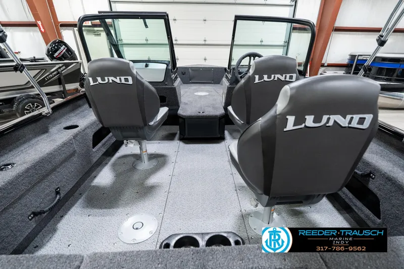 Slide: The Image of 2025 Lund 1775 Adventure Sport boat interior with dual seats and steering console. - 15
