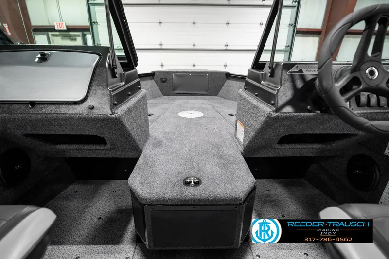 Slide: The Image of 2025 Lund 1775 Adventure Sport boat interior with gray carpet and dual consoles. - 29