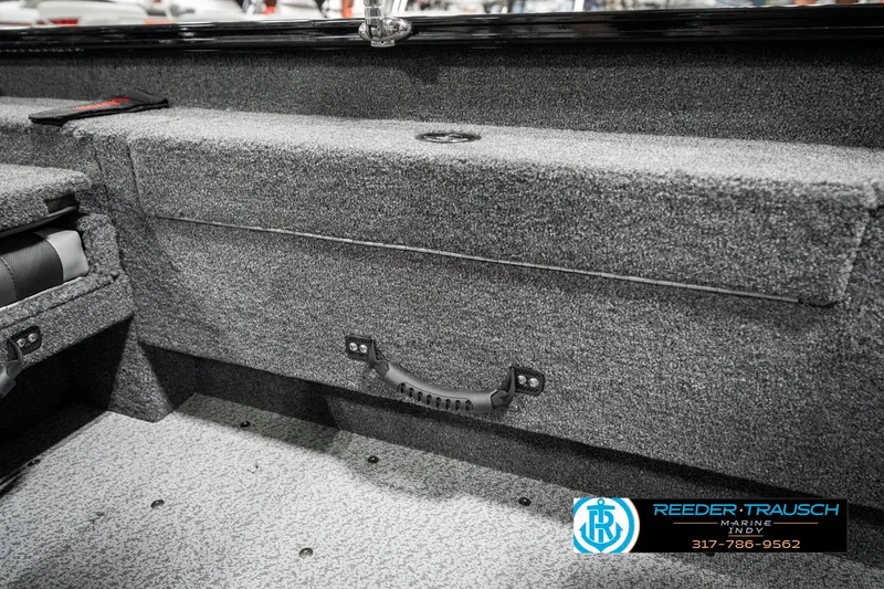 Slide: The Image of 2025 Lund 1775 Adventure Sport boat interior with carpeted storage compartment. - 31