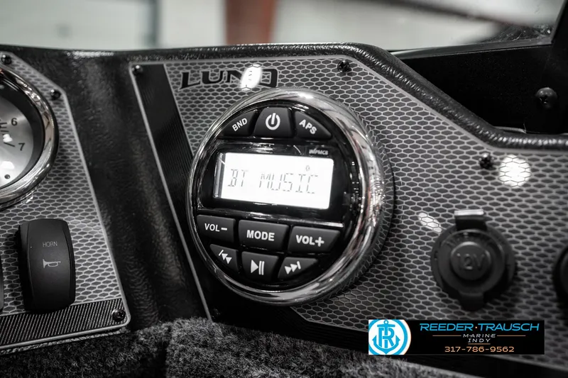 Slide: The Image of Dashboard of 2025 Lund 1775 Adventure Sport boat with audio controls. - 38