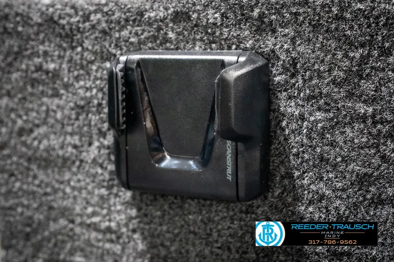 Slide: The Image of 2025 Lund 1775 Adventure Sport interior detail with black accessory on textured surface. - 39