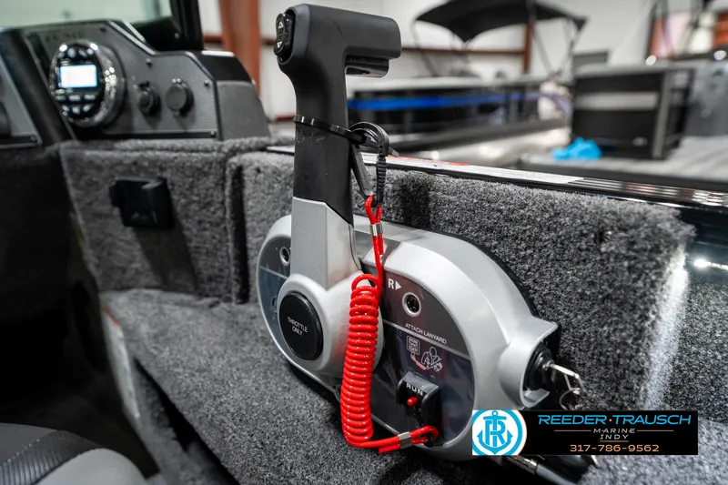 Slide: The Image of 2025 Lund 1775 Adventure Sport boat throttle control with safety lanyard, interior view. - 40