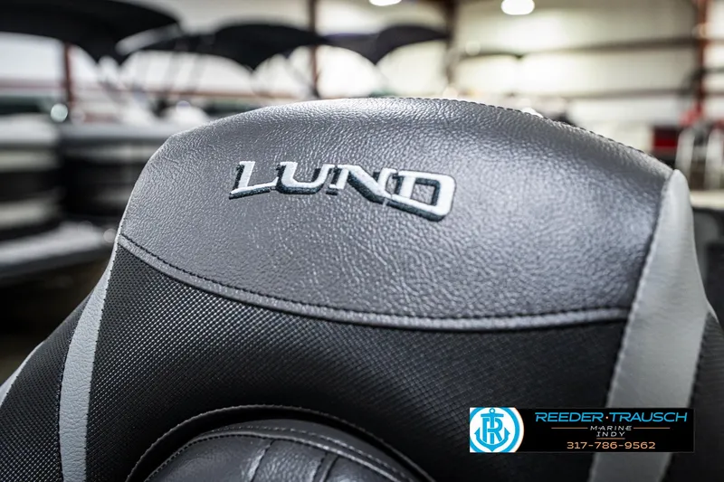 Slide: The Image of 2025 Lund 1775 Adventure Sport boat seat with logo in showroom setting. - 42
