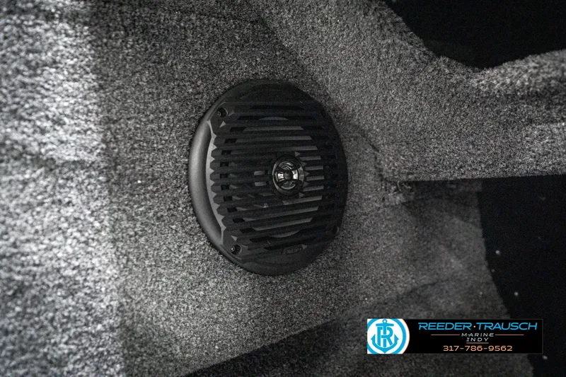 Slide: The Image of Speaker installed in 2025 Lund 1775 Adventure Sport boat interior, featuring textured gray carpeting. - 44