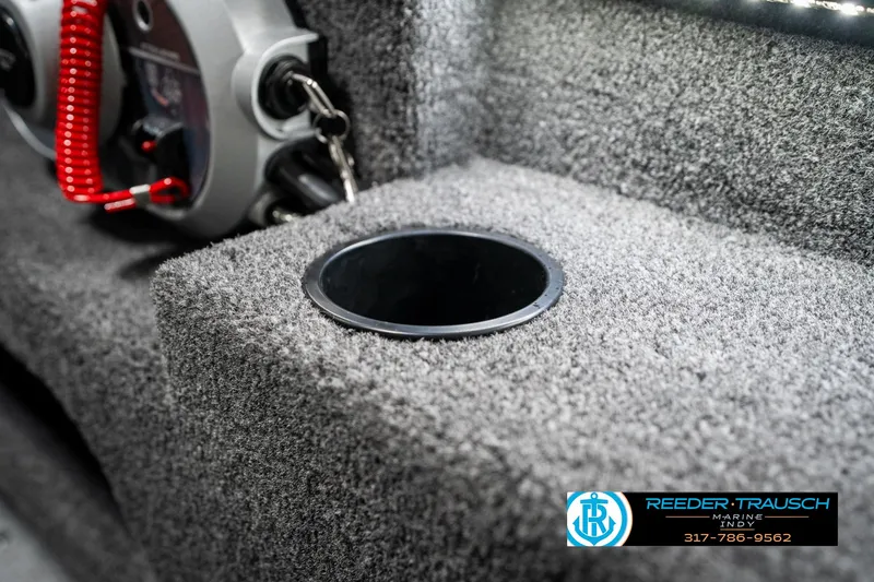 Slide: The Image of 2025 Lund 1775 Adventure Sport boat interior with cup holder and control panel. - 45