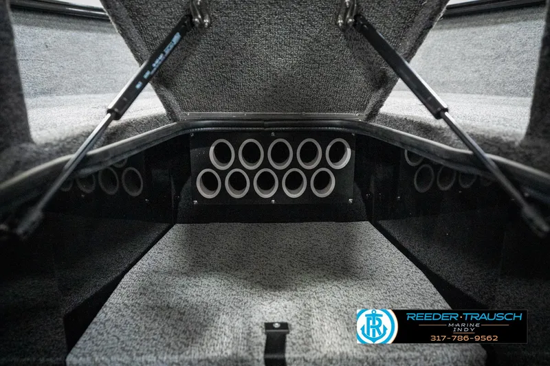 Slide: The Image of 2025 Lund 1775 Adventure Sport boat storage compartment with multiple rod holders. - 47