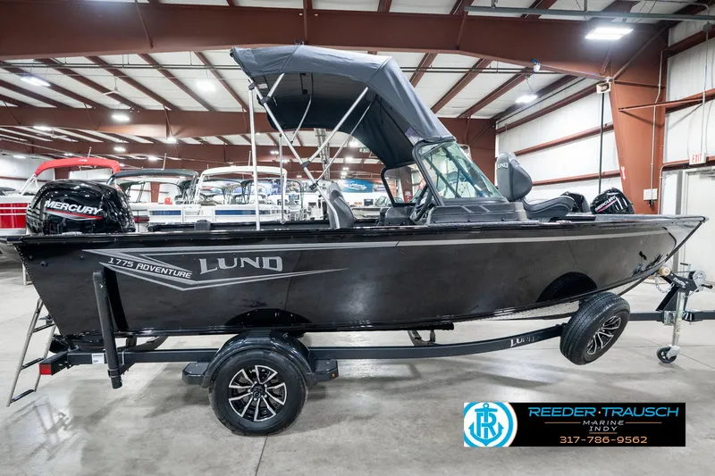 Slide: The Image of 2025 Lund 1775 Adventure Sport boat with Mercury engine in showroom. - 6