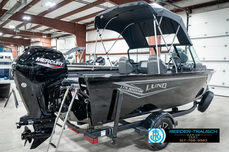 Slide: The Image of 2025 Lund 1775 Adventure Sport boat with Mercury engine in a showroom. - 7