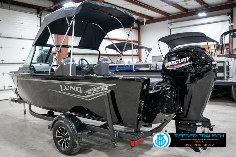 Slide: The Image of 2025 Lund 1775 Adventure Sport boat with Mercury engine in showroom. - 9