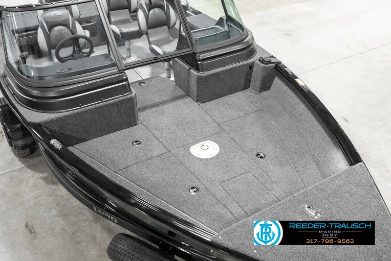 Slide: The Image of 2025 Lund 1875 Impact XS boat with spacious deck and dual console design. - 13