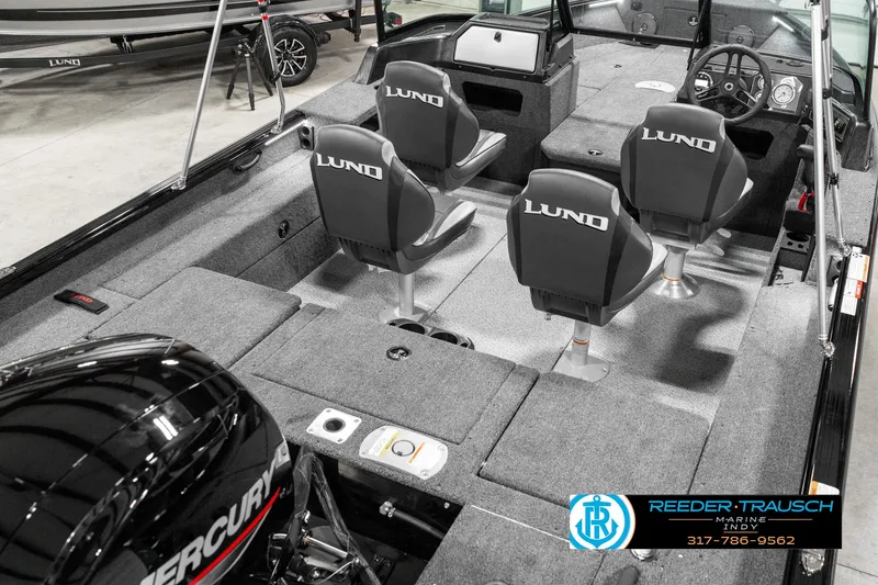 Slide: The Image of 2025 Lund 1875 Impact XS boat interior with four seats and Mercury engine. - 14