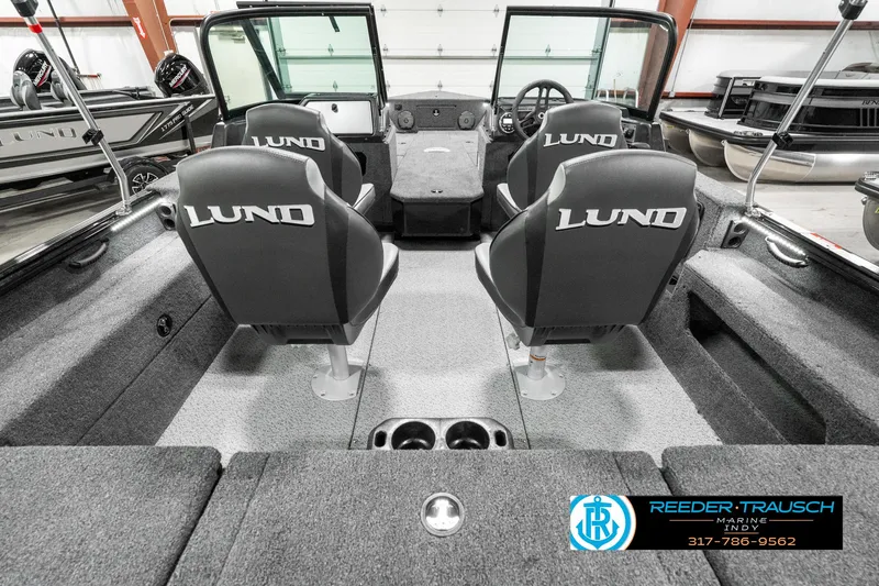Slide: The Image of 2025 Lund 1875 Impact XS boat interior with four seats and steering console. - 16