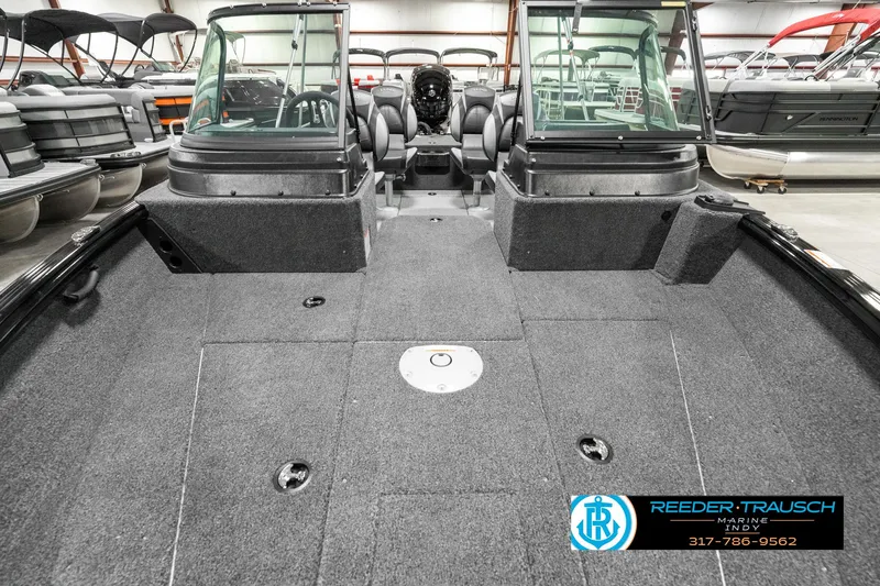 Slide: The Image of 2025 Lund 1875 Impact XS boat interior with spacious deck and seating. - 19