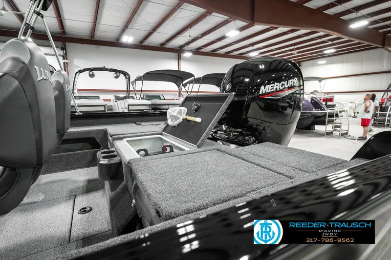 Slide: The Image of 2025 Lund 1875 Impact XS boat with Mercury engine in showroom. - 28