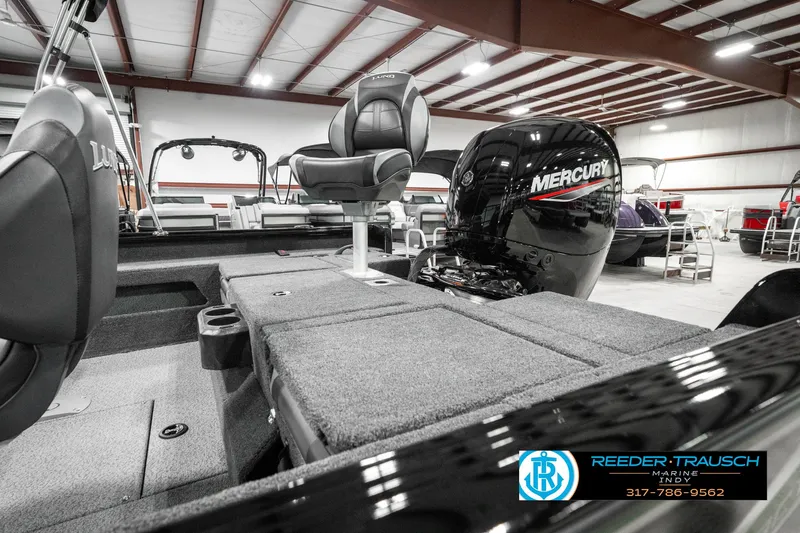 Slide: The Image of 2025 Lund 1875 Impact XS boat with Mercury engine in showroom. - 30