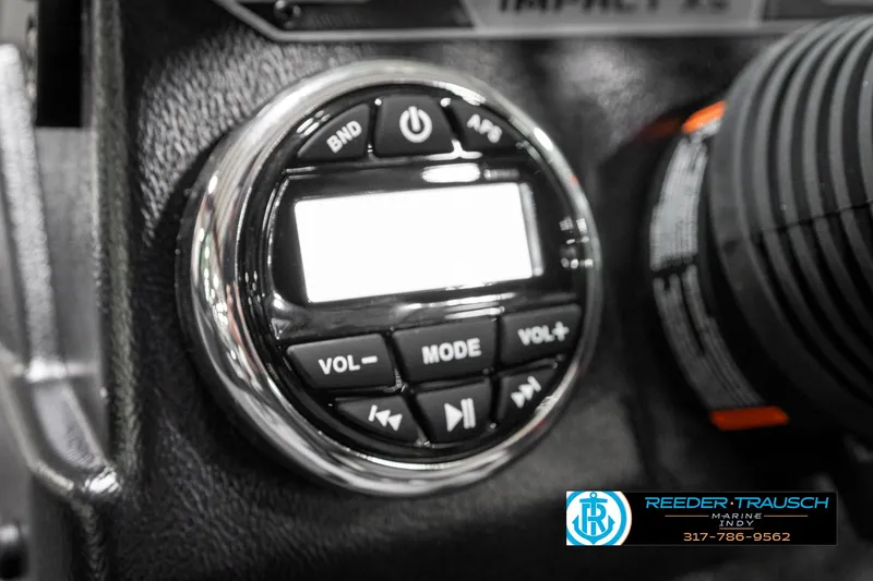 Slide: The Image of 2025 Lund 1875 Impact XS boat dashboard with control panel and buttons. - 40