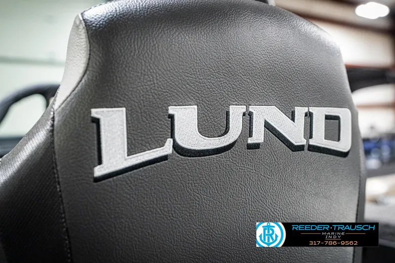 Slide: The Image of 2025 Lund 1875 Impact XS boat seat with logo, featuring Reeder-Trausch Marine branding. - 47