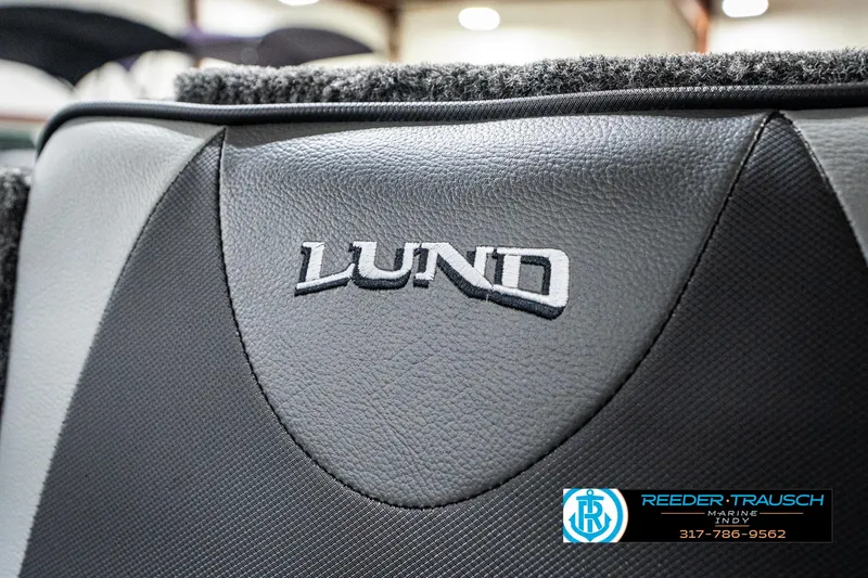 Slide: The Image of 2025 Lund 1875 Impact XS boat interior with logo detail. - 48