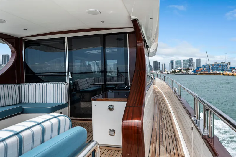 Slide: The Image of Luxurious 2021 Steeler 60 S Performance yacht with elegant deck and city skyline view. - 18