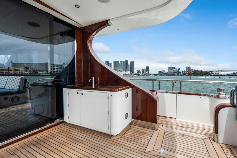 Slide: The Image of Luxury yacht deck of 2021 Steeler 60 S Performance with city skyline view. - 22
