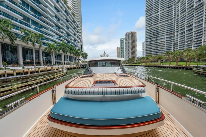 Slide: The Image of 2021 Steeler 60 S Performance yacht cruising in urban waterway with skyscrapers. - 28