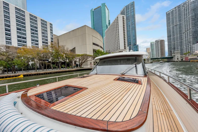 Slide: The Image of Luxurious 2021 Steeler 60 S Performance yacht cruising in urban waterway with city skyline. - 29