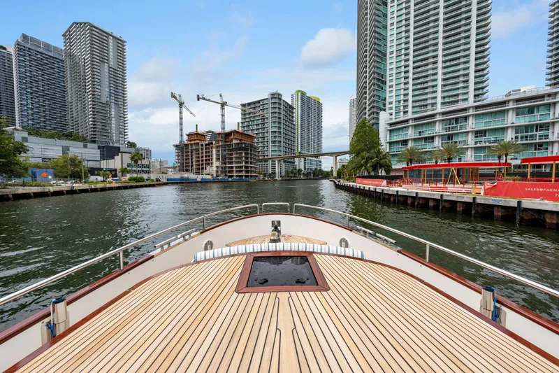 Slide: The Image of Bow view of 2021 Steeler 60 S Performance yacht in urban waterway setting. - 30
