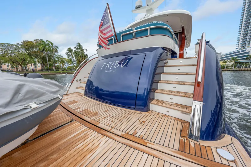Slide: The Image of Luxury Steeler 60 S Performance yacht, 2021 model, with wooden deck and American flag. - 34
