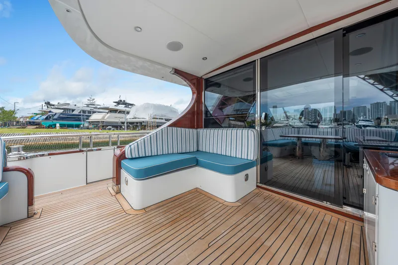 Slide: The Image of 2021 Steeler 60 S Performance yacht deck with seating, docked at marina. - 38