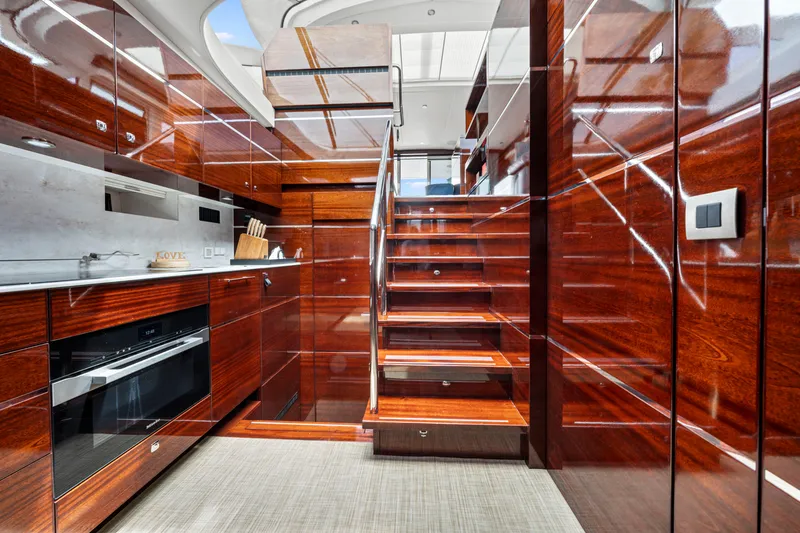 Slide: The Image of Luxurious interior of 2021 Steeler 60 S Performance yacht with polished wood finish. - 41