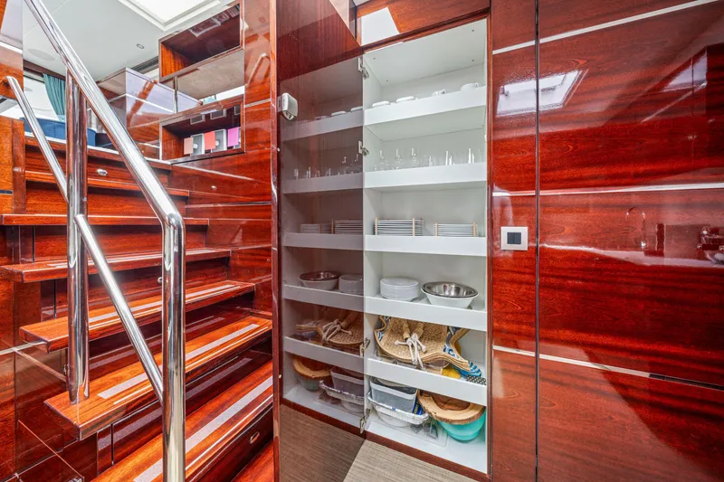 Slide: The Image of Luxurious interior of 2021 Steeler 60 S Performance yacht with elegant wooden staircase and pantry. - 43